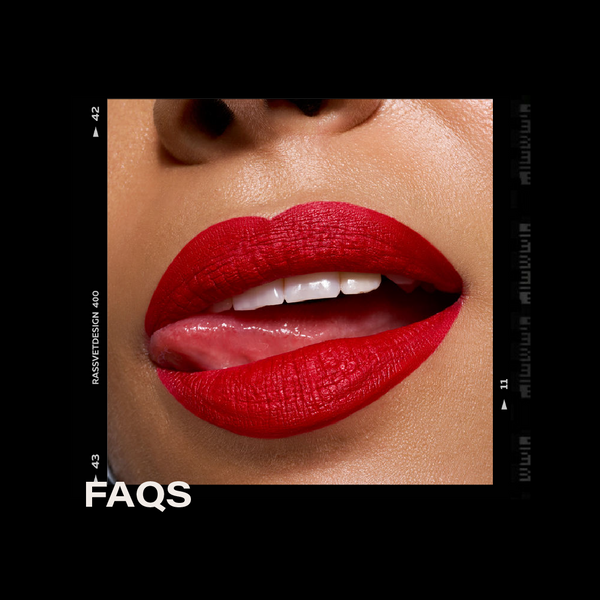 Close-up of a person's lips with red lipstick, brand name visible on a black background.